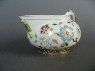 A rare 19th C.  Herend porcelain cream jug with china man handle and spout. 2