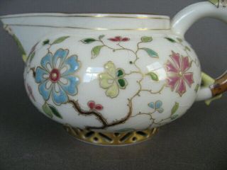 A rare 19th C.  Herend porcelain cream jug with china man handle and spout. 3