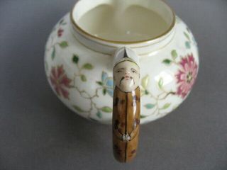 A rare 19th C.  Herend porcelain cream jug with china man handle and spout. 4