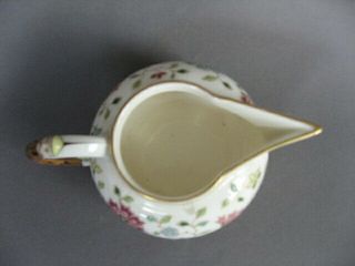 A rare 19th C.  Herend porcelain cream jug with china man handle and spout. 6