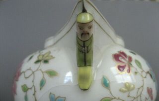 A rare 19th C.  Herend porcelain cream jug with china man handle and spout. 8