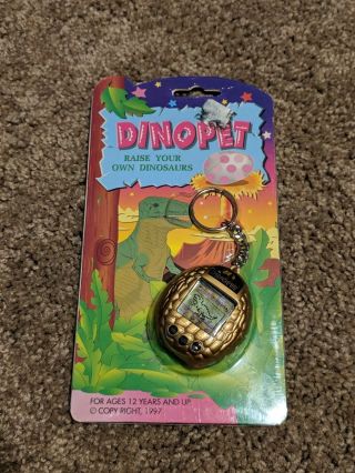 1997 Nano Dino Pet Virtual Pet Giga Pets Tamagotchi Gold Egg Shape Rare
