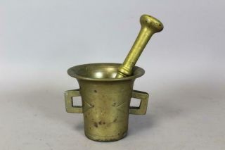 A RARE DECORATED 17TH C BRASS DOUBLE HANDLE MORTAR AND PESTLE IN OLD SURFACE 2