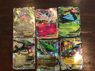 30 Pokémon trading cards including ultra rare mcharizard and HO - OH 3