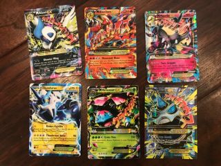30 Pokémon trading cards including ultra rare mcharizard and HO - OH 4
