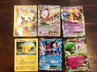 30 Pokémon trading cards including ultra rare mcharizard and HO - OH 5