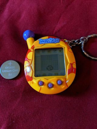 2004 Tamagotchi Connection V4 Yellow / Red Pattern W/ Purple Buttons Rare Bandai