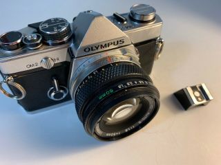 Olympus Om - 2 35mm Camera.  C/w 50mm F/1.  8 Lens & Rare Detach Hot Shoe.  “lot 123”