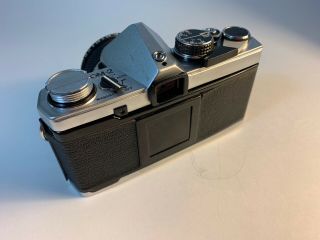 Olympus OM - 2 35mm Camera.  C/W 50mm F/1.  8 lens & rare detach hot shoe.  “Lot 123” 2