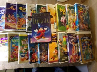 18,  1 Classic Disney Vhs Tapes Toy Story,  Cinderella,  Tarzan,  1 Rare Fantasia
