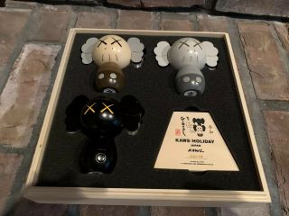 Kaws: Holiday Japan Limited Wood Kokeshi Doll Set (set Of 3) In Hand.