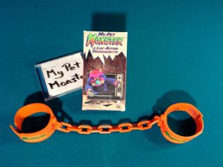 Vintage My Pet Monster Amtoy with handcuffs and VHS movie in 8