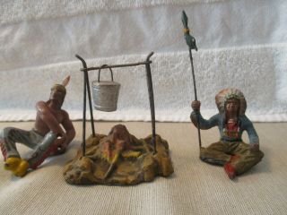 Elastilolin Man Tied to Tree,  2 Standing Chiefs 2 Sitting Indians,  Fire W POt, 3