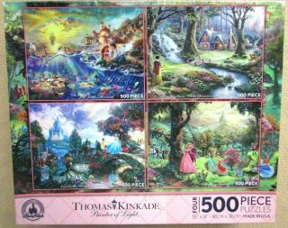A Set Of 4 - 500 Piece Jigsaw Puzzles By Thomas Kinkade And Disney