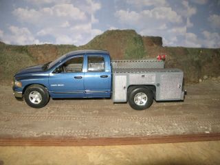 1/18 2002 Dodge Four Door Dually With Custom Utility Bed.