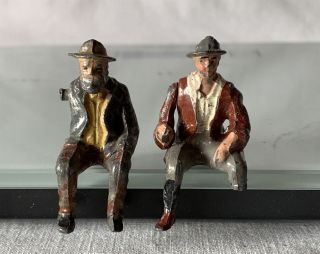 2 Seated Britains Era Painted Lead Sitting Figures Both 1 Missing Arm / Damage
