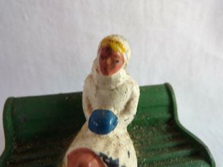 VINTAGE DIECAST TOY SOLDIER WOMAN SITTING ON BENCH FIGURE 2