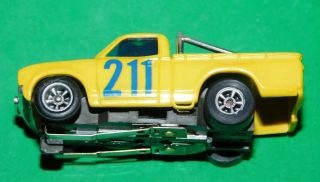 AURORA AFX TOMY NISSAN DATSUN PICK UP TRUCK YELLOW Slot Car HO Running Chassis 3