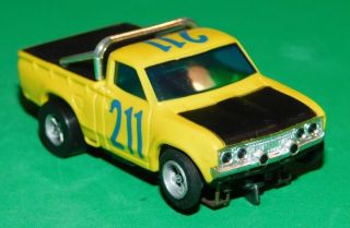 AURORA AFX TOMY NISSAN DATSUN PICK UP TRUCK YELLOW Slot Car HO Running Chassis 5