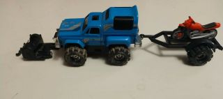 Stomper 4x4 Blue Chevy Stepside With Trailer And Winch.