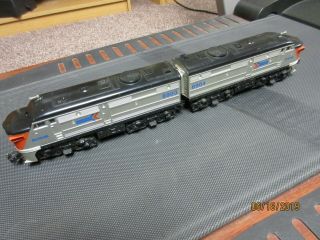 Lionel No.  8903 & 8904 Amtrak Diesel Engine & 4 - Amtrak Pass.  Cars,  C - 6 Cond.