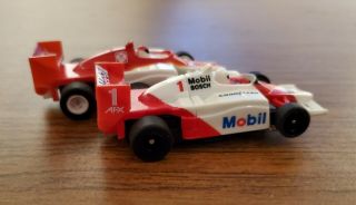 Nascar and Formula One 1/64 4 slot car bodies and chassis 2