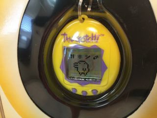 1997 Bandai Tamagotchi Yellow With Purple Buttons 2