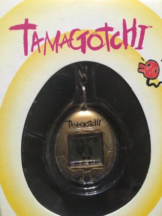 Gold 1996 - 97 Tamagotchi Keychain. 2