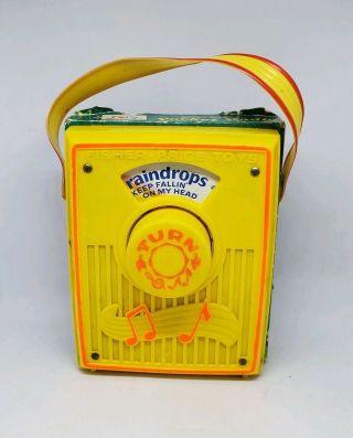 Vintage Fisher Price Music Box Pocket Radio " Raindrops Keep Falling On My Head "