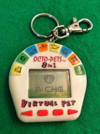 Octo - Pets 8 In 1 Virtual Pets 1997 By Phosphorous Inc Tamagotchi Like Pet