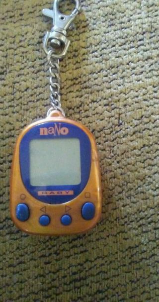 Nano Baby Playmates Virtual Pet 1997 Orange With Blue Frame | Tamagotchi