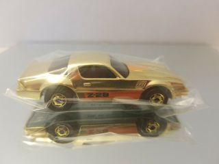Hot Wheels Gold Chrome Camaro Z - 28 Mail In Larry Wood.  Bagged With Seal.
