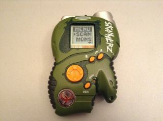Radica Skannerz Electronic Handheld Game Pataak Tribe (green)