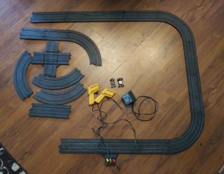 Vintage Tyco Slot Car Track With Two Cars And Two Triggers.