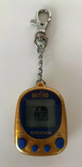 1997 Playmates Toys Nano Baby Virtual Pet Clear Orange Batteries