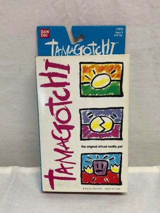 1996 - 1997 Bandai Tamagotchi White With Gey Buttons