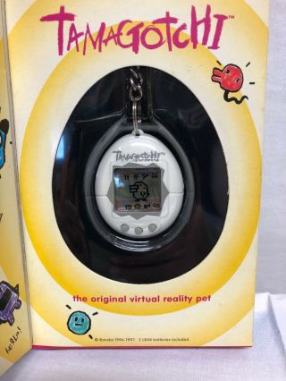 1996 - 1997 Bandai Tamagotchi White With Gey Buttons 2