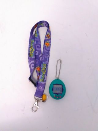 1997 Bandai Tamagotchi Green & Purple W/ Batteries & Lanyard