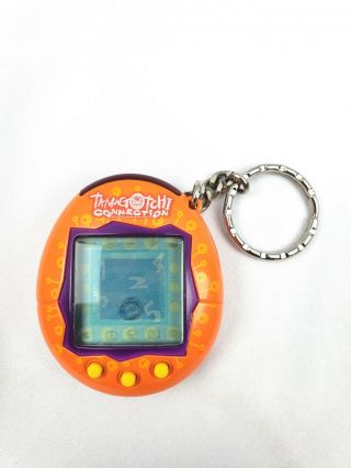 Tamagotchi Connection Virtual Pet Version 1 (v1) 2004 Bandai Orange