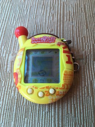 2004 Tamagotchi Connection Red Yellow Binary.  Key Chain