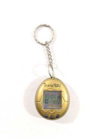 1997 Bandai Tamagotchi Gold With Black Letters And Buttons
