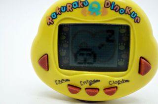 RakuRaku DinoKun Dinkie Dino Yellow Digital Electronic Virtual Pet Tamagotchi 2