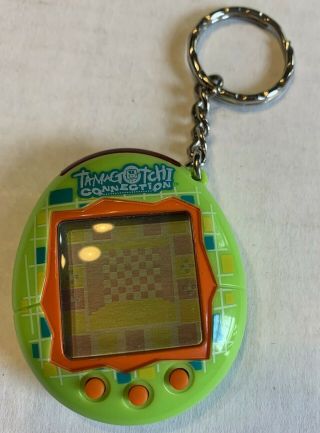 2004 Tamagotchi Connection V1 Bandai Green Orange Virtual Digital Pet Keychain