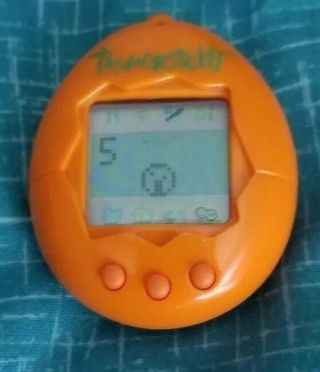Vintage 1997 Tamagotchi P2 Virtual Pet Orange Green Batteries Installed