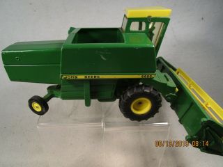 John Deere 6600 combine with plastic gear drive auger & reel by Ertl toys 1/24th 3