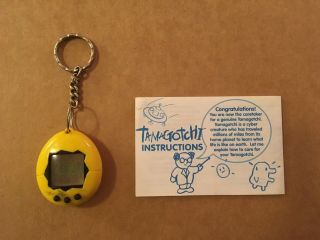 Vintage 1997 Tamagotchi Yellow And Black,  With Instructions