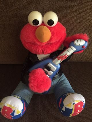 He Sings,  Plays Guitar And Shakes Rattles And Rolls Elmo