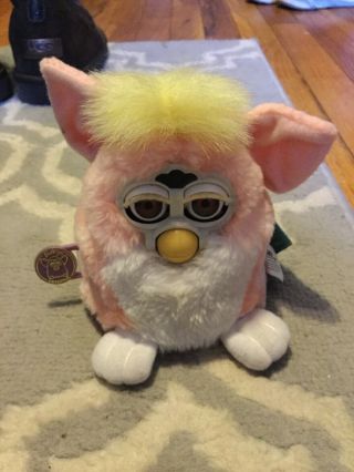 1998 Furby Baby By Tiger Electronics Pink & White Blue Eyes Yellow Top Knot Tail