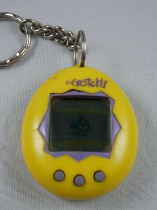 Vintage Virtual Pet Keychain TAMAGOTCHI Bandai Yellow Purple 2
