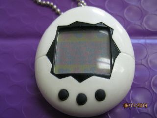 1997 Bandai Tamagotchi White with black - -.  Virtual pet keychain 4